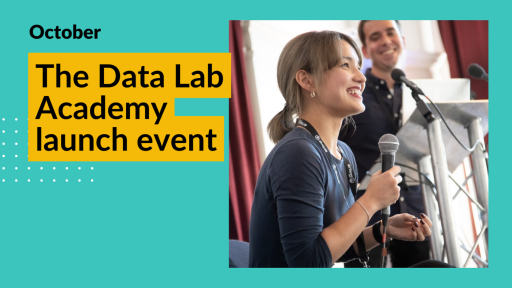 A young woman participating in the launch event holds a microphone and looks up smiling from the stage she is sitting on. Overlay text reads "The Data Lab Academy launch event"