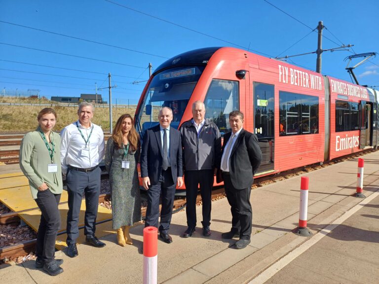 Photo of Business Minister Richard Lochhead pictured with staff from Scottish Enterprises and Edinburgh Trams in front of a tram.
