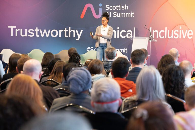 Photo at Scottish AI Summit 2024 of keynote speaker Oyidiya Oji