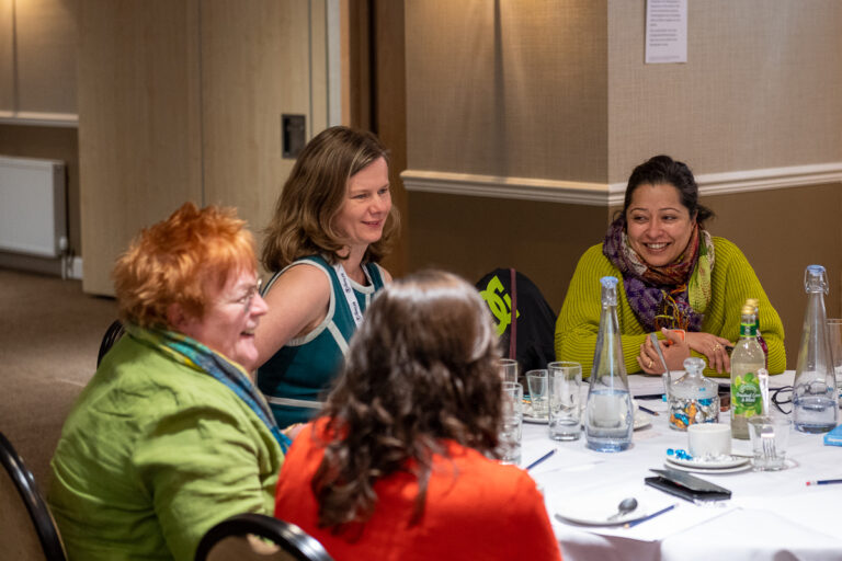 The Data Lab Leadership training session with 4 women sitting at a table