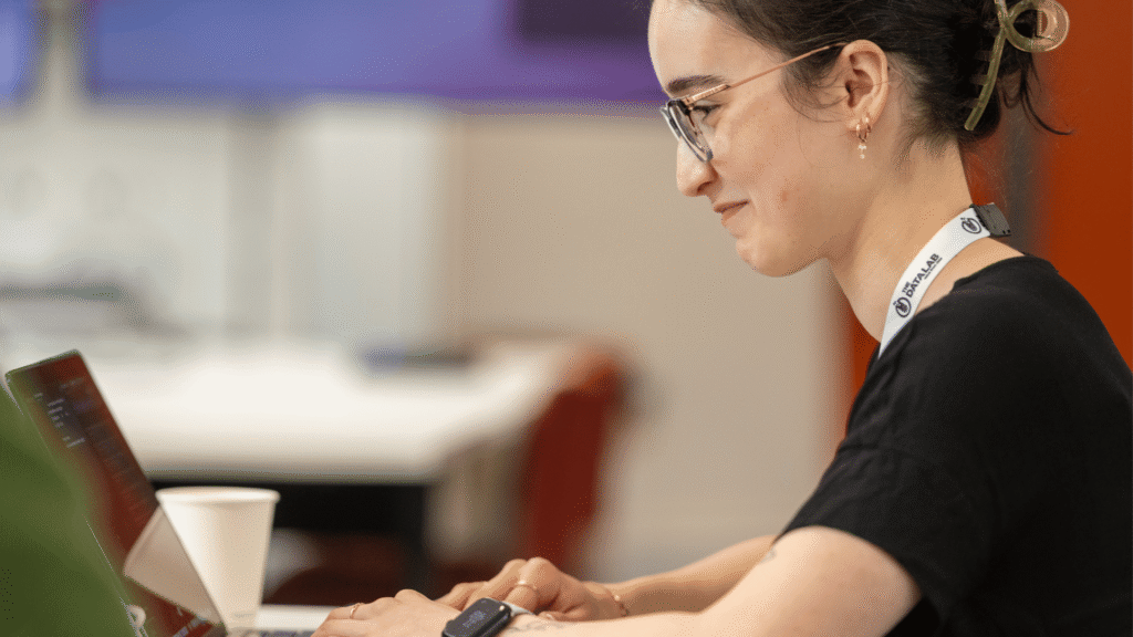 Woman sitting and working from a laptop